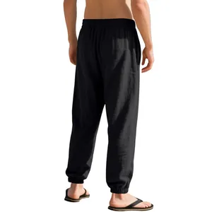 Men's loose black linen joggers shown from back view for casual summer style