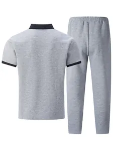 Back view of men's casual gray jacquard polo shirt and trousers set with black trim