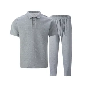 Macro view showing gray textured jacquard fabric of men's polo and pants casual set