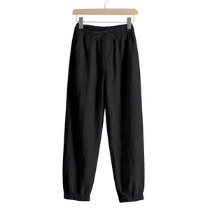 Men's loose linen jogger pants with elastic waist and drawstring in solid black color