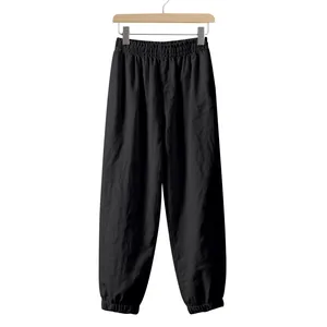 Loose black linen jogger pants for men featuring elastic waist and beam foot detail