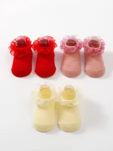 Detailed view of breathable cotton baby socks with elegant lace ruffles in multiple colors