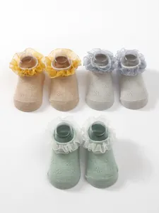 Detail of children's breathable ruffle ballet princess socks in various colors
