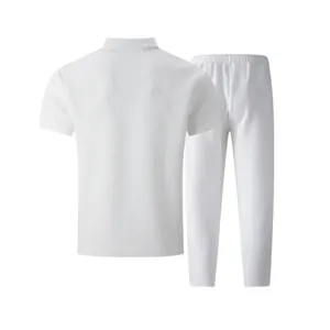 Back view of white men's polo shirt and pants set with textured jacquard pattern