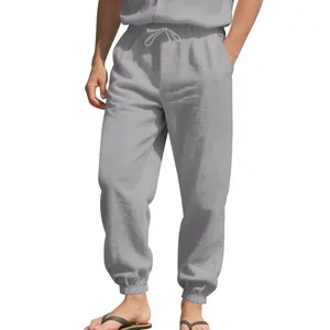 Close-up of men's loose linen joggers with drawstring waist and elastic cuffs fit