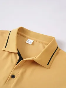 Detailed view of yellow jacquard polo shirt collar showing size M label inside