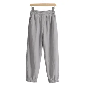 Front view of grey men's linen jogger pants with drawstring waist and elastic cuffs