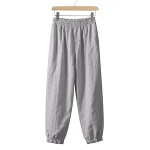 Comfortable men's loose fit linen jogger pants in light grey, premium summer casual style