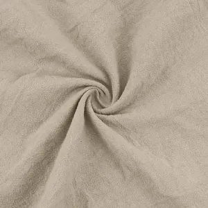 Macro texture detail of beige natural linen fabric for summer casual pants