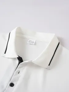 Close-up detail of white jacquard polo shirt collar with black trim and size tag