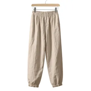 High-quality detailed view of men's beige linen joggers featuring elastic waist and cuffs
