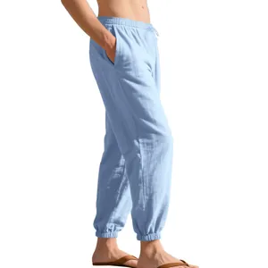 Side view of light blue men's linen jogger pants with drawstring waist and elastic cuffs