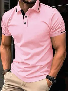 Close-up of pink jacquard polo shirt with black trim details on collar and sleeves