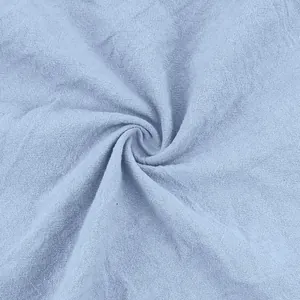 Macro detail of light blue breathable linen fabric texture for men's casual pants