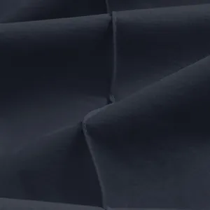Close-up macro view showing the fine twill texture and seam detail of dark navy casual pants.