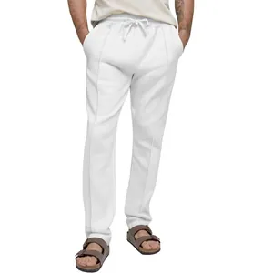 Detail of men's white solid color sports casual sweatpants with elastic drawstring waist