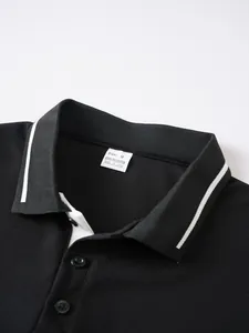 Close-up of men's black jacquard Polo shirt collar with white stripes and label