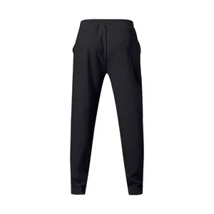 Back view of classic black men's cotton joggers with elastic waistband and straight leg