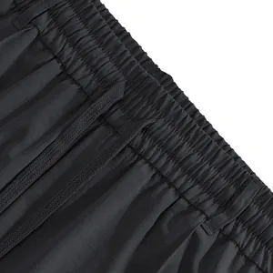 Close-up of elastic waistband with drawstring on men's slim fit casual pants