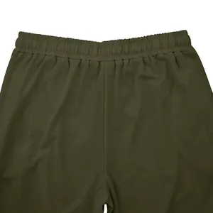 Close-up of the elastic waistband on army green men's casual sweatpants