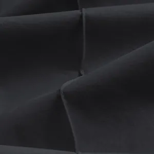 Close-up detail of dark grey twill fabric showing high-quality stitching and texture.