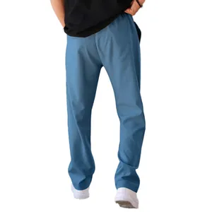 Detail view of men's blue straight-leg casual pants with a comfortable loose fit