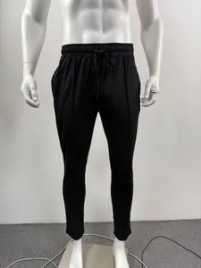 Men's solid black casual sports sweatpants featuring an adjustable drawstring elastic waist