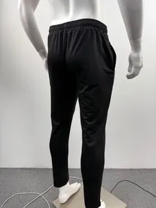 Detailed back view of men's black loose straight-leg sweatpants with elastic waistband