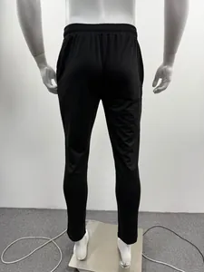 Rear view of minimalist men's black athletic joggers with comfortable elastic waist