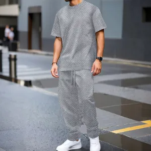 Macro view of grey textured jacquard fabric on a men's casual two-piece summer set
