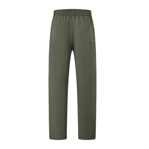 Back view of olive green men's slim fit casual pants featuring an elastic waistband