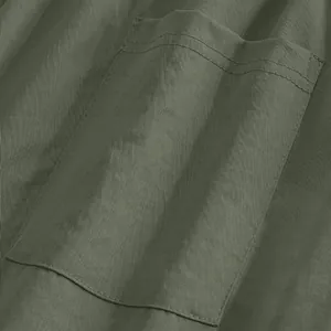 Detail view of army green men's casual pants showing pocket stitching and fabric texture