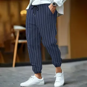 Detail view of men's striped linen joggers with drawstring waist and elastic cuffs