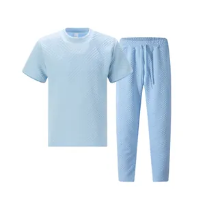 Detailed view of light blue men's leisure set showing heavyweight jacquard texture