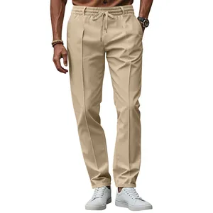 Detail of khaki slim-fit trousers with elastic drawstring waist and front pleats