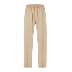 Detailed shot of men's beige slim fit business casual trousers with drawstring waist.