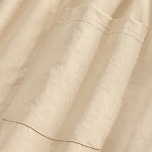 Close-up detail of the durable patch pocket on men's beige slim fit casual trousers