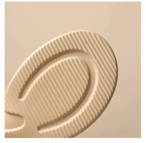 Detailed view of the thick lightweight sole on a modern women's sandal with anti-slip grip