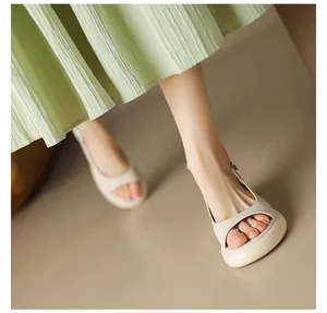 Detailed view of minimalist thick-soled women's peep-toe sandals in stylish beige