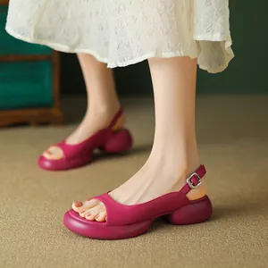 Close-up detail view of fuchsia thick-sole women's sandals with adjustable buckle strap