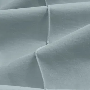 Macro detail showing the high-quality twill fabric and stitching of men's casual pants.