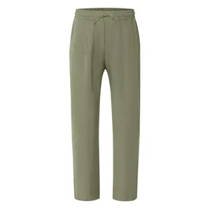 Macro view of men's olive green breathable cotton linen trousers with drawstring