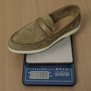 Close-up detail of a brown suede loafer showing its lightweight design at 178.4g