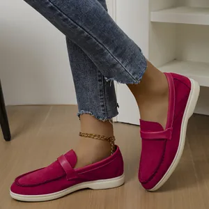 Detail view of women's magenta suede loafers with casual slip-on design and flat sole