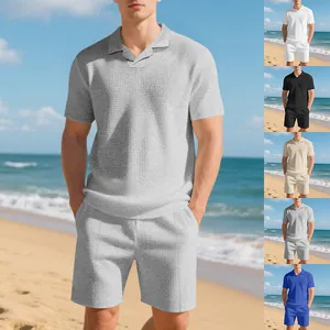 Men's summer waffle knit polo shirt and shorts set in multiple color options on beach.