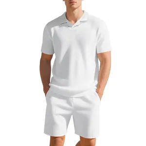 Detail view of men's white waffle knit polo shirt and matching casual shorts set