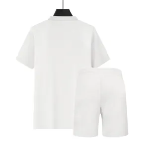 Detailed back view of men's white waffle knit loose polo shirt and casual shorts two-piece set