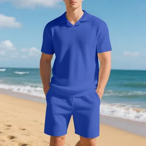 Men's royal blue waffle knit Polo shirt and matching shorts summer set on a sunny beach