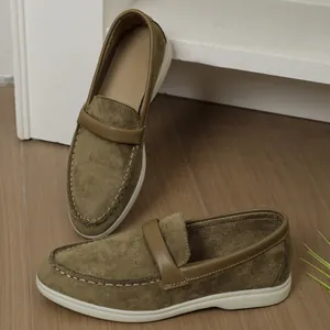 Side and top view of brown suede loafers with white stitching and flat rubber sole.