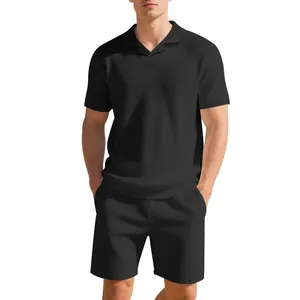 Detail view of men's black waffle knit polo shirt and shorts set for summer